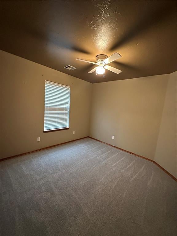 712 N Cherokee Way, Mustang, OK 73064 - spare room with ceiling fan and light carpet