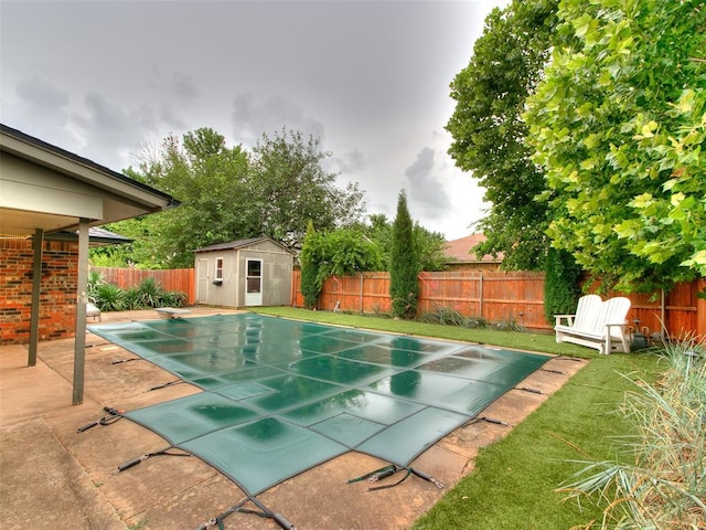 1040 Mabel C Fry Blvd, Yukon, OK 73099 - view of swimming pool featuring a diving board, a fenced backyard, a storage unit, and a patio