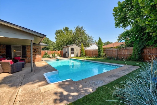 1040 Mabel C Fry Blvd, Yukon, OK 73099 - view of swimming pool featuring a fenced backyard, a patio, a shed, and a diving board