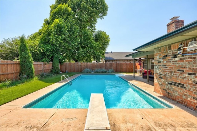 1040 Mabel C Fry Blvd, Yukon, OK 73099 - view of swimming pool with a fenced backyard, a patio, and a diving board