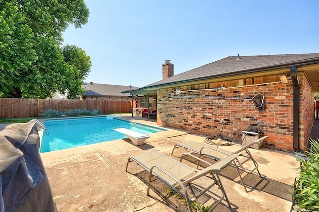 1040 Mabel C Fry Blvd, Yukon, OK 73099 - view of pool featuring a fenced backyard, a patio area, and a diving board