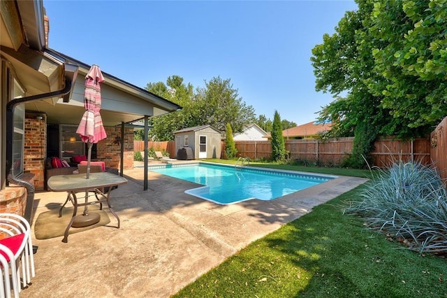 1040 Mabel C Fry Blvd, Yukon, OK 73099 - view of pool featuring a patio area, a fenced backyard, and a storage shed
