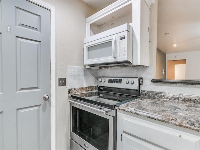 1040 Mabel C Fry Blvd, Yukon, OK 73099 - kitchen with white microwave, electric stove, decorative backsplash, light stone counters, and white cabinetry