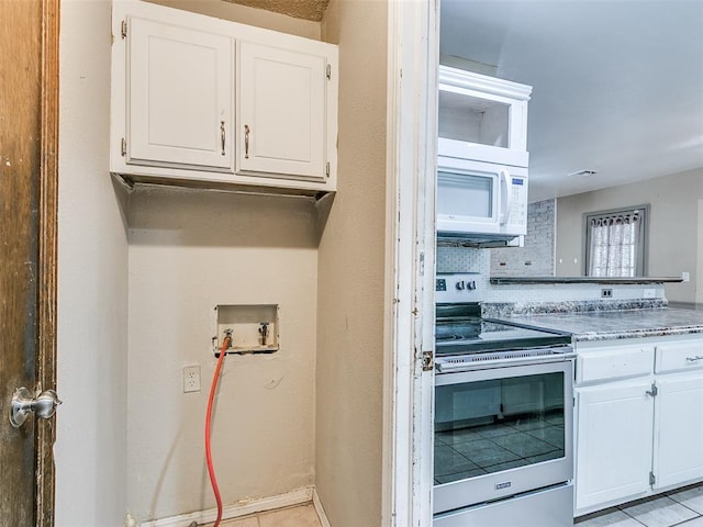 1040 Mabel C Fry Blvd, Yukon, OK 73099 - kitchen featuring white appliances, white cabinetry, and light tile patterned floors