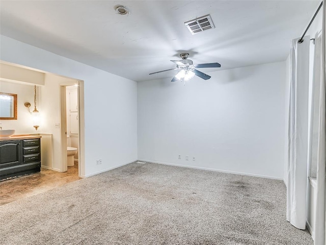 1040 Mabel C Fry Blvd, Yukon, OK 73099 - unfurnished bedroom with light colored carpet, ensuite bathroom, and a ceiling fan