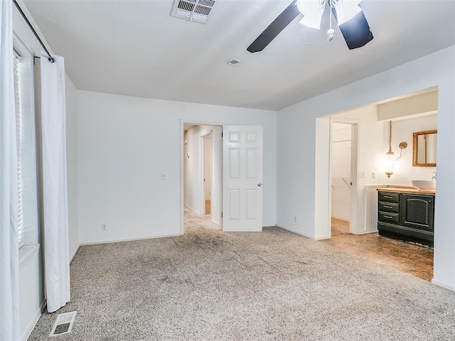 1040 Mabel C Fry Blvd, Yukon, OK 73099 - unfurnished bedroom featuring carpet, ensuite bath, and ceiling fan