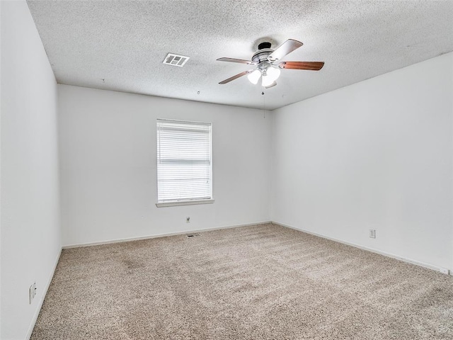 1040 Mabel C Fry Blvd, Yukon, OK 73099 - empty room featuring carpet floors, ceiling fan, and a textured ceiling