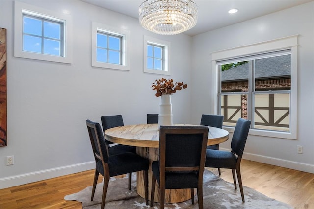 1517 Station St, Edmond, OK 73034 - dining room with wood finished floors, a chandelier, and recessed lighting