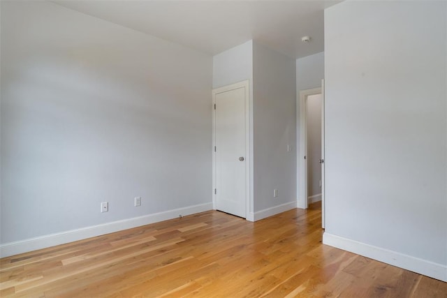 1517 Station St, Edmond, OK 73034 - spare room with baseboards and light wood finished floors