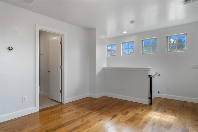 1517 Station St, Edmond, OK 73034 - empty room featuring light wood-style flooring and recessed lighting