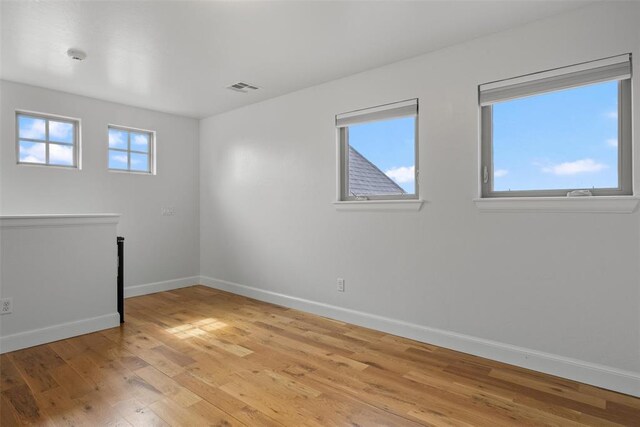 1517 Station St, Edmond, OK 73034 - empty room featuring baseboards and light wood finished floors