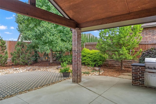 1517 Station St, Edmond, OK 73034 - fenced backyard featuring a patio area and a grill