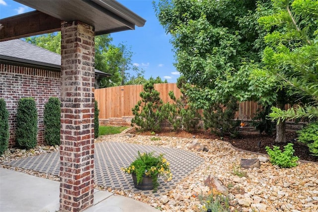 1517 Station St, Edmond, OK 73034 - fenced backyard featuring a patio