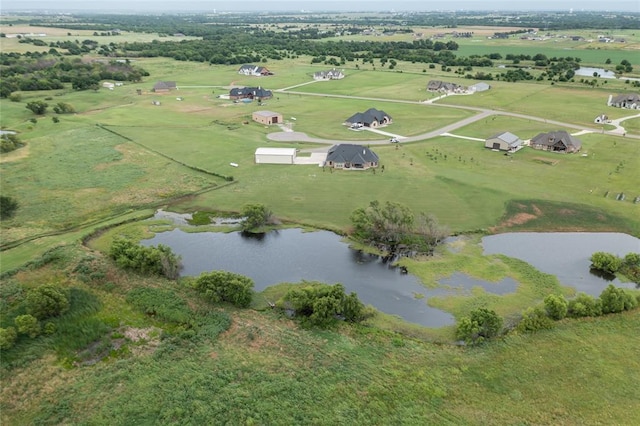 15936 SW 12th St, Yukon, OK 73099 - aerial overview of property's location with a nearby body of water and rural landscape