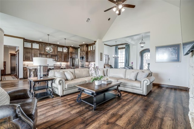 15936 SW 12th St, Yukon, OK 73099 - living room with a ceiling fan, dark wood-style flooring, high vaulted ceiling, recessed lighting, and arched walkways
