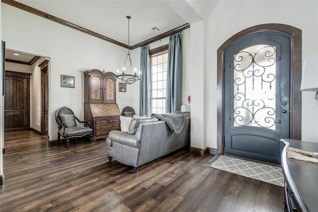 15936 SW 12th St, Yukon, OK 73099 - entryway featuring ornamental molding, dark wood-type flooring, a chandelier, and arched walkways