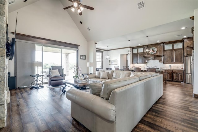 15936 SW 12th St, Yukon, OK 73099 - living area featuring high vaulted ceiling, a ceiling fan, dark wood-style flooring, and recessed lighting