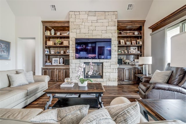 15936 SW 12th St, Yukon, OK 73099 - living area with wood finished floors, a stone fireplace, vaulted ceiling, and built in features