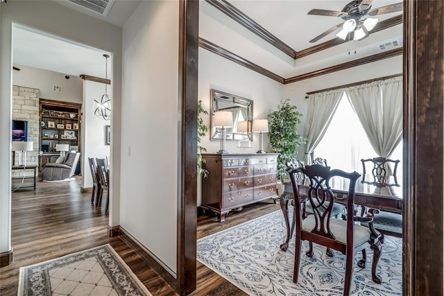 15936 SW 12th St, Yukon, OK 73099 - dining space featuring ceiling fan, dark wood-type flooring, and ornamental molding