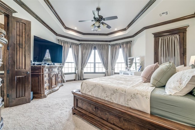 15936 SW 12th St, Yukon, OK 73099 - bedroom with a raised ceiling, ornamental molding, carpet, multiple windows, and a ceiling fan