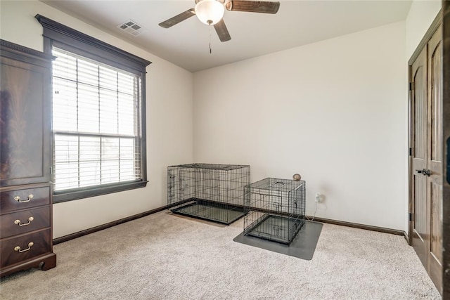 15936 SW 12th St, Yukon, OK 73099 - unfurnished bedroom featuring carpet, multiple windows, and ceiling fan