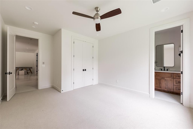 3005 Bee Hive Way, Jones, OK 73049 - unfurnished bedroom featuring light colored carpet, a closet, ensuite bathroom, and ceiling fan