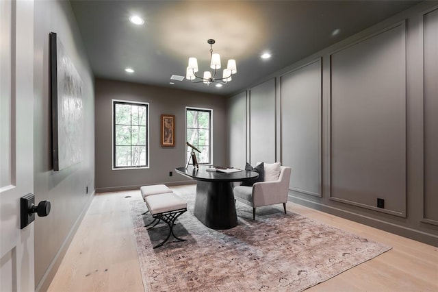 3005 Bee Hive Way, Jones, OK 73049 - dining area featuring a chandelier, light wood-type flooring, a decorative wall, and recessed lighting
