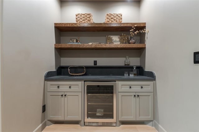 3005 Bee Hive Way, Jones, OK 73049 - indoor dry bar with wine cooler and wood finished floors