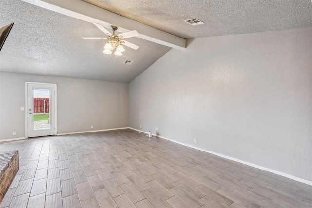 1909 Magnolia Ln, Edmond, OK 73013 - empty room with wood finished floors, a ceiling fan, and a textured ceiling