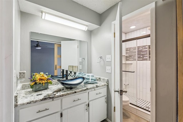 1909 Magnolia Ln, Edmond, OK 73013 - full bathroom with vanity, a stall shower, and ceiling fan