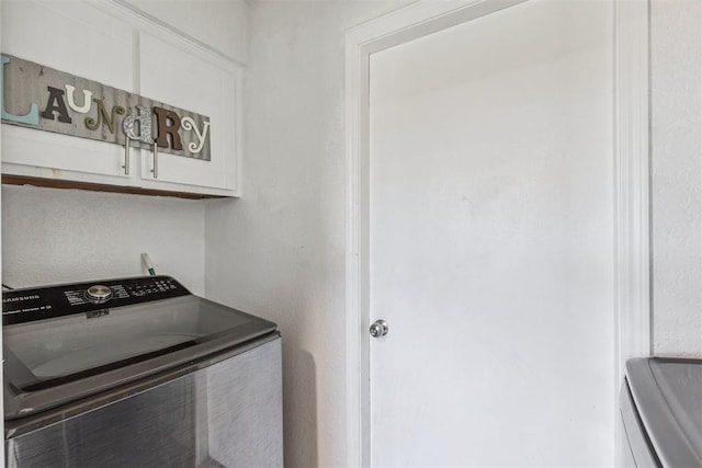 1909 Magnolia Ln, Edmond, OK 73013 - washroom featuring washer / clothes dryer and cabinet space