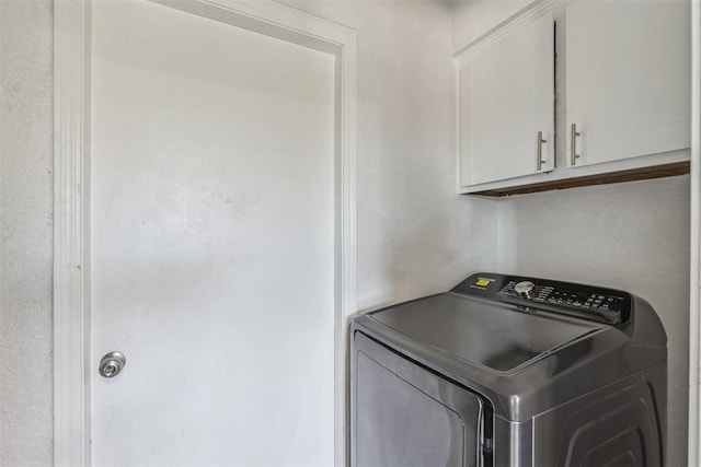 1909 Magnolia Ln, Edmond, OK 73013 - laundry area with washer / clothes dryer and cabinet space