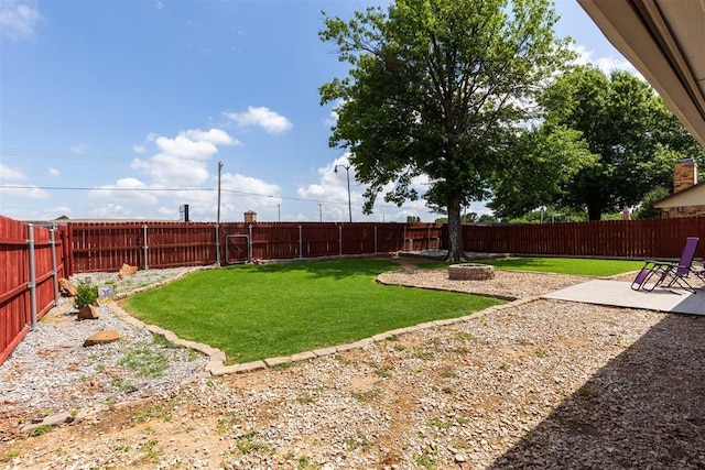 1909 Magnolia Ln, Edmond, OK 73013 - fenced backyard featuring a patio