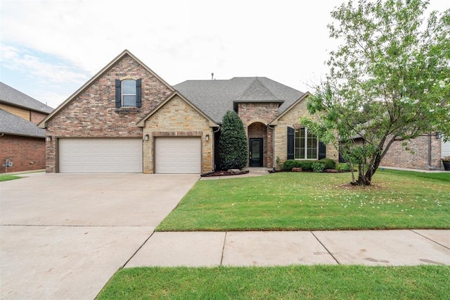 413 Branch Line Rd, Yukon, OK 73099 - view of front of house with concrete driveway, a front lawn, brick siding, a shingled roof, and an attached garage