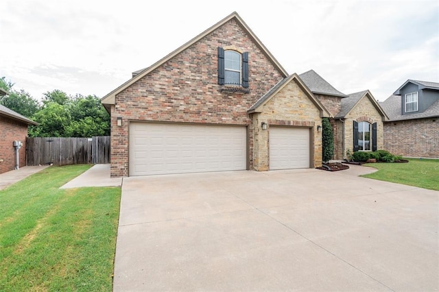 413 Branch Line Rd, Yukon, OK 73099 - view of front of property featuring an attached garage, driveway, and brick siding