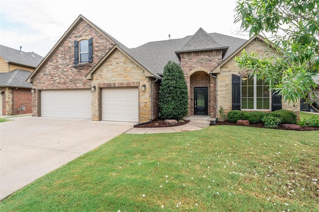 413 Branch Line Rd, Yukon, OK 73099 - view of front of property with concrete driveway, a front yard, roof with shingles, brick siding, and stone siding