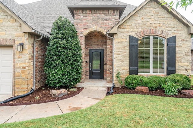 413 Branch Line Rd, Yukon, OK 73099 - entrance to property with roof with shingles, stone siding, and a lawn