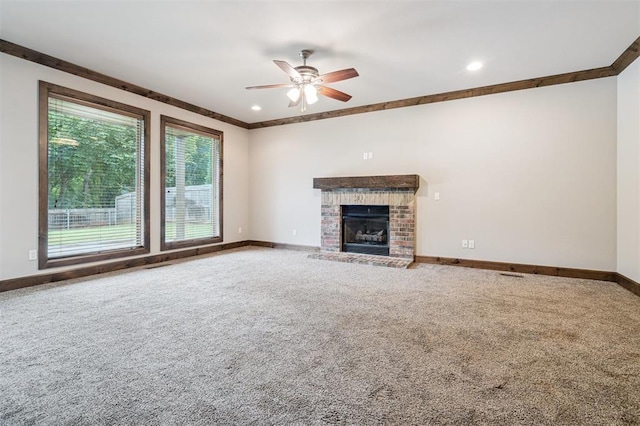 413 Branch Line Rd, Yukon, OK 73099 - unfurnished living room with carpet floors, ceiling fan, a brick fireplace, recessed lighting, and ornamental molding