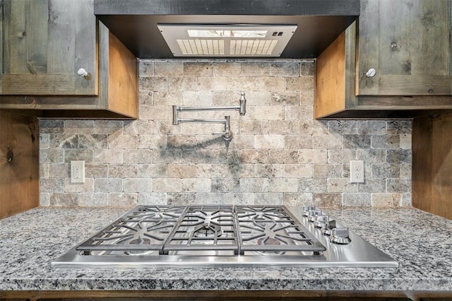 413 Branch Line Rd, Yukon, OK 73099 - kitchen featuring stainless steel gas cooktop, extractor fan, and decorative backsplash
