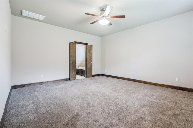 413 Branch Line Rd, Yukon, OK 73099 - carpeted spare room featuring ceiling fan and baseboards