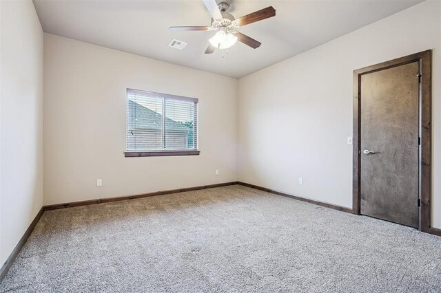 413 Branch Line Rd, Yukon, OK 73099 - carpeted spare room featuring ceiling fan and baseboards
