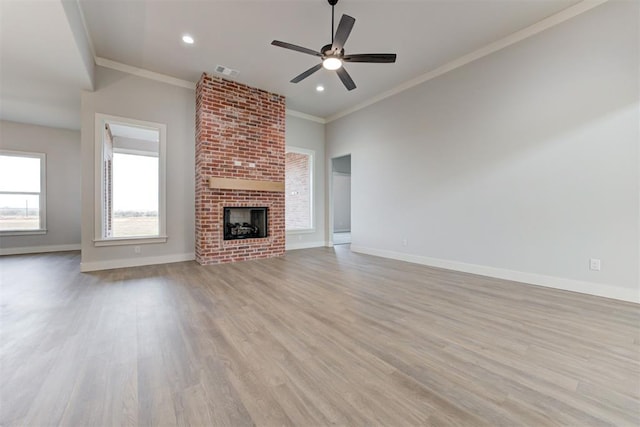 4337 Pinon Ln, Piedmont, OK 73078 - unfurnished living room with wood finished floors, a ceiling fan, recessed lighting, ornamental molding, and a brick fireplace