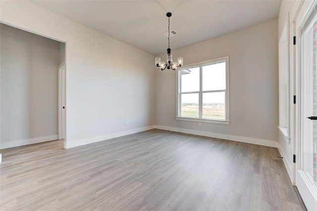 4337 Pinon Ln, Piedmont, OK 73078 - unfurnished room with a chandelier and light wood-style flooring