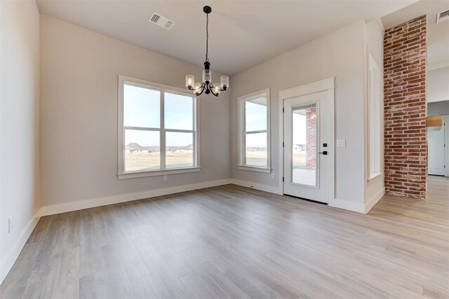 4337 Pinon Ln, Piedmont, OK 73078 - unfurnished dining area featuring a chandelier and light wood finished floors