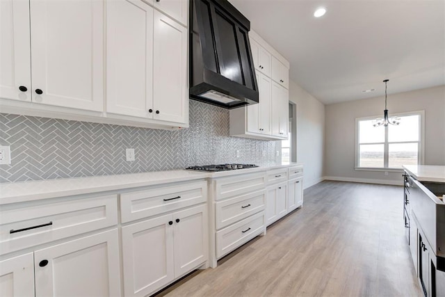 4337 Pinon Ln, Piedmont, OK 73078 - kitchen featuring custom range hood, gas stovetop, light countertops, backsplash, and recessed lighting