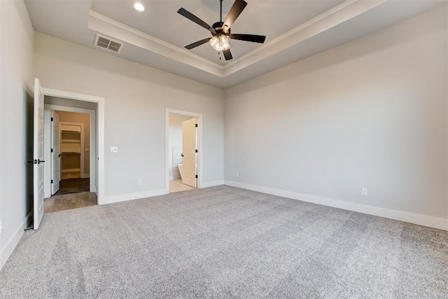4337 Pinon Ln, Piedmont, OK 73078 - unfurnished bedroom featuring carpet flooring, a tray ceiling, ensuite bath, recessed lighting, and a ceiling fan