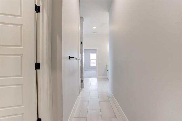 4337 Pinon Ln, Piedmont, OK 73078 - corridor featuring light tile patterned flooring and baseboards