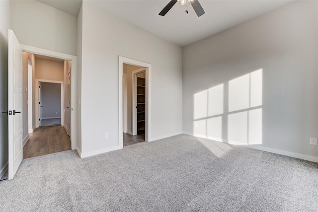 4337 Pinon Ln, Piedmont, OK 73078 - unfurnished bedroom with carpet floors, a walk in closet, ceiling fan, and a closet