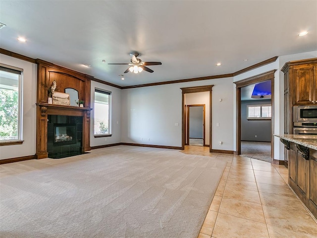 13705 Cascata Strada St, Oklahoma City, OK 73170 - unfurnished living room featuring a ceiling fan, crown molding, recessed lighting, light tile patterned floors, and a fireplace