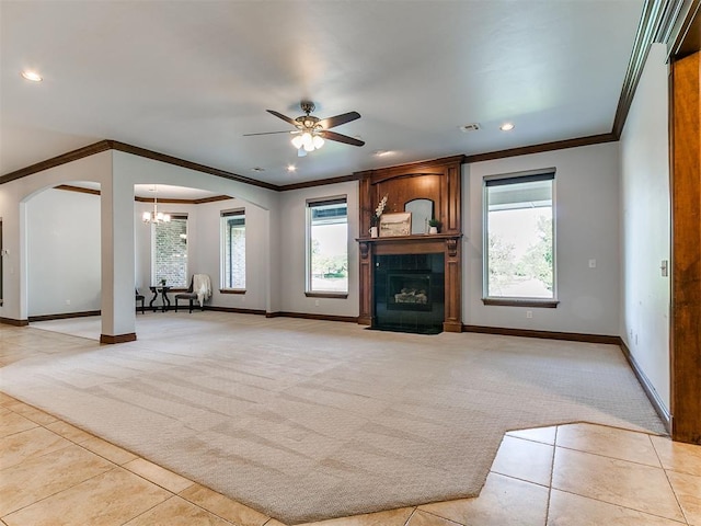 13705 Cascata Strada St, Oklahoma City, OK 73170 - unfurnished living room featuring light colored carpet, arched walkways, ornamental molding, light tile patterned floors, and recessed lighting